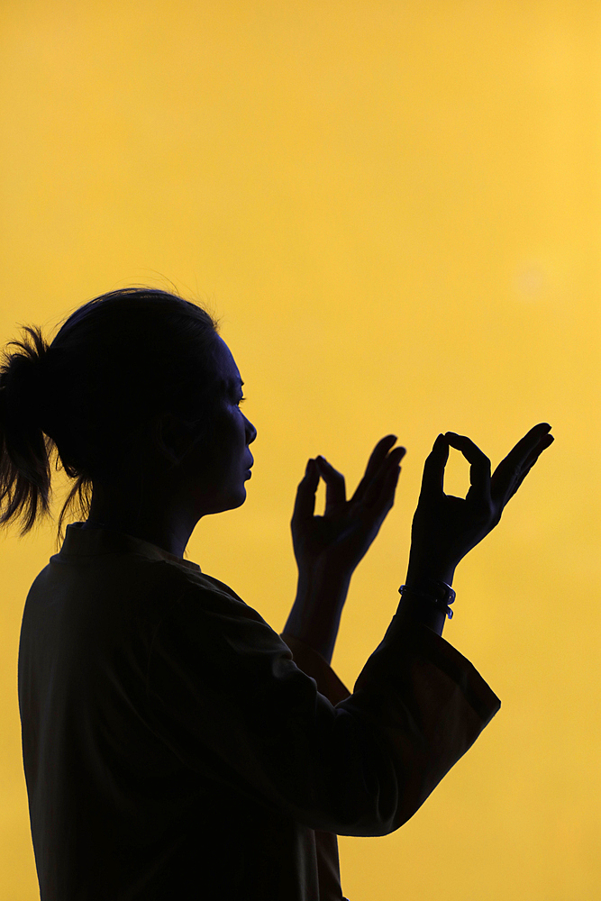 Silhouette of woman praying in temple Faith and spirituality concept, Vietnam, Indochina, Southeast Asia, Asia