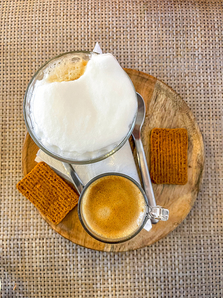 Coffees and biscuits served in a bar in Brussels, Belgium, Europe