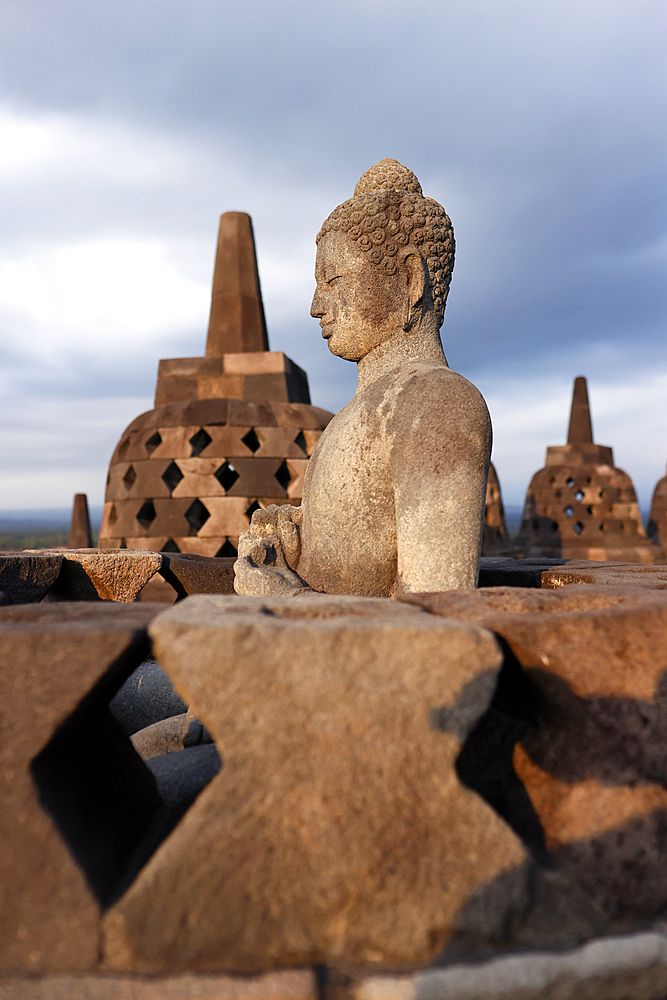 Borobudur, 9th-century Mahayana Buddhist temple. UNESCO World Heritage. Stone Buddha statue. Java. Indonesia.