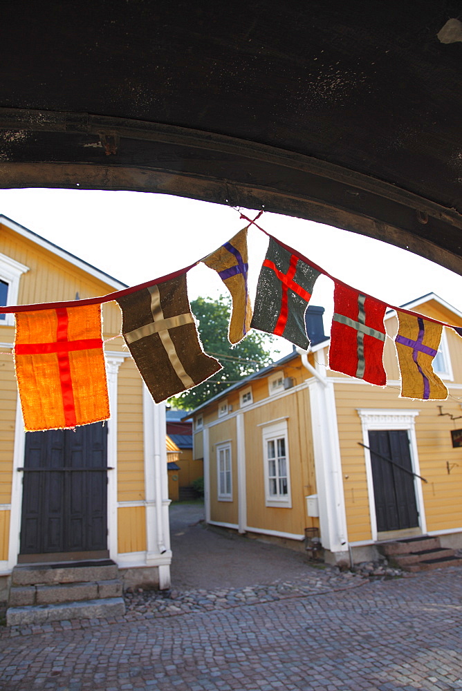 Decorative flags and medieval wooden houses, Porvoo, Uusimaa, Finland, Scandinavia, Europe