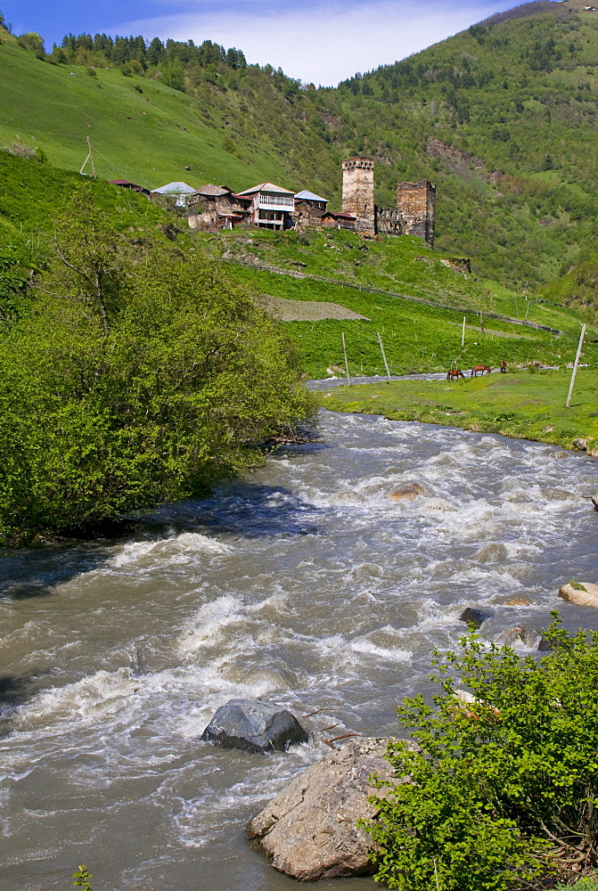 Little river running below a fortified mountain village, Svanetia, Georgia, Caucasus, Central Asia, Asia