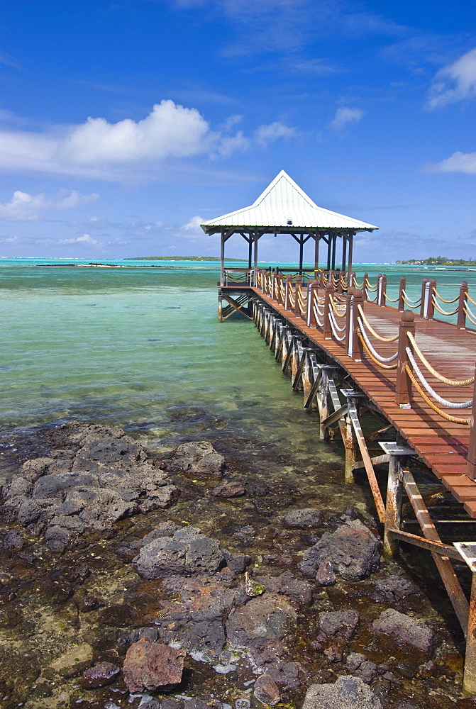 A pier is leading into the blue sea and ends in a small hut, Mauritius, Indian Ocean, Africa