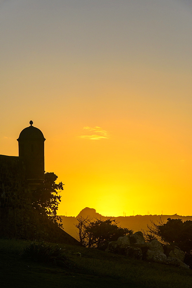 Backlit watchtower of the Fortress of Fortaleza San Felipe, Puerto Plata, Dominican Republic, West Indies, Caribbean, Central America