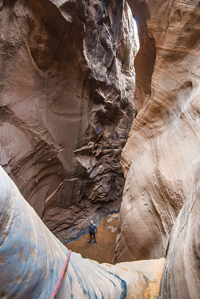 Man standing in a slot canyon after canyoneering, Moab, Utah, United States of America, North America