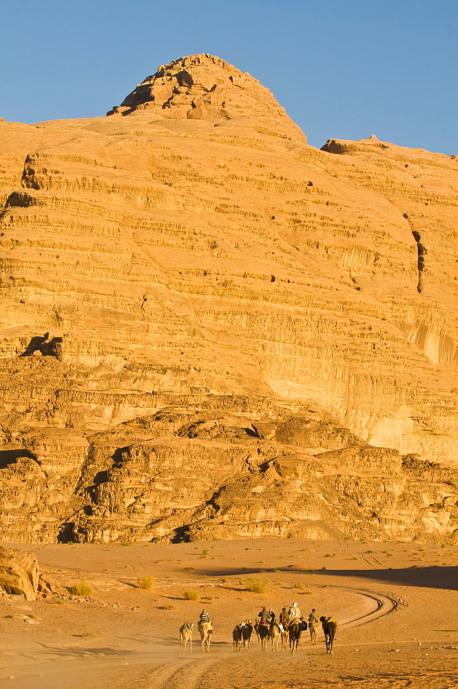 Camel caravan in the stunning desert scenery of Wadi Rum, Jordan, Middle East