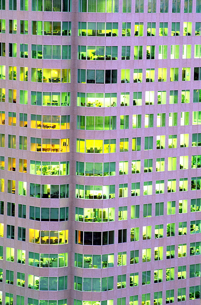 Close-up of office tower with rooms illuminated, Toronto, Ontario, Canada, North America