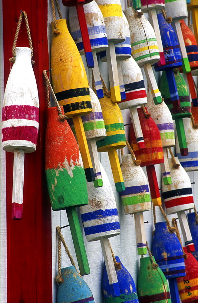 Group of colorful lobster buoys hanging on a wall, Ellsworth, Maine, New England, United States of America, North America