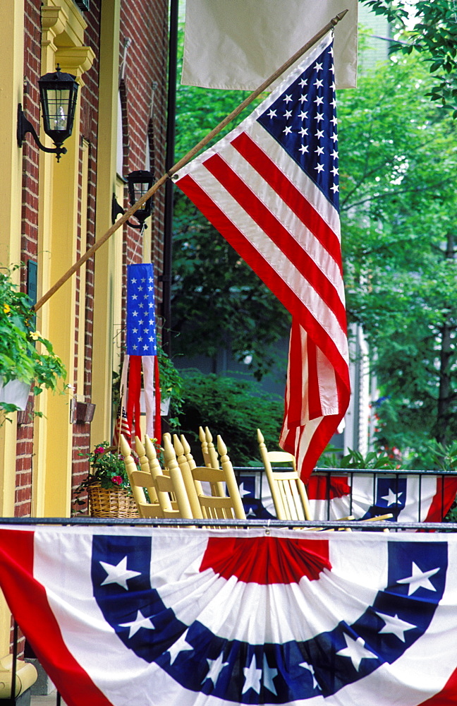 Flag displayed on porch with bunting, Chautauqua, New York, United States of America, North America