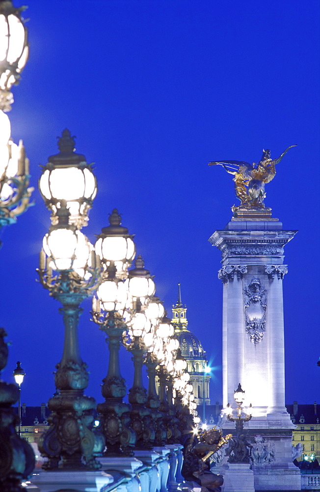 Pont Alexandre III with ornate lamps, illuminated at dusk, Paris, France, Europe