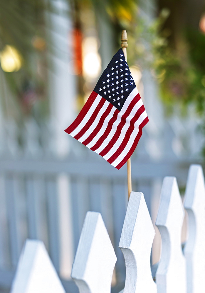 American flag on white picket fence, Key West, Florida, United States of America, North America