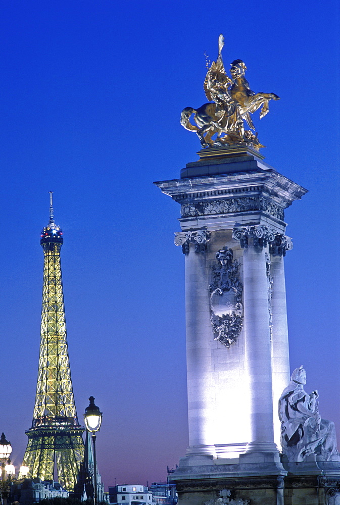 Pont Alexandre III and the Eiffel Tower illuminated at night, Paris, France, Europe