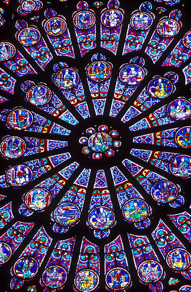 North Rose Window, 13th century stained glass window depicting the Virgin Mary encircled by figures, Notre Dame, Paris, France, Europe