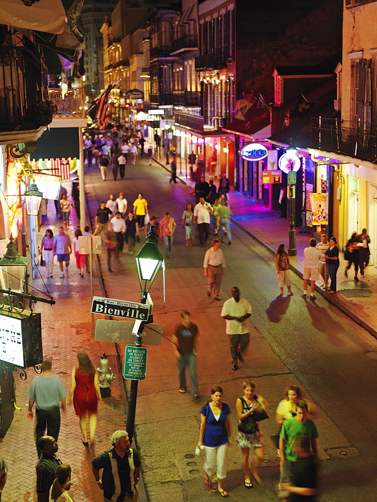 Bourbon Street at dusk with tourists, French Quarter, New Orleans, Louisiana, United States of America, North America