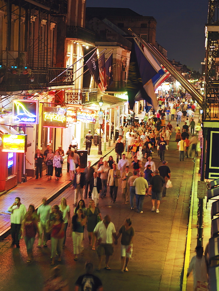 Bourbon Street at dusk with tourists, French Quarter, New Orleans, Louisiana, United States of America, North America