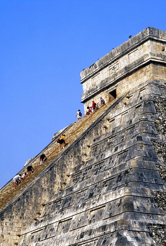 Tourists climbing the Pyramid of Kukulcan (El Castillo), Chichen Itza, UNESCO World Heritage Site, Mexico, North America