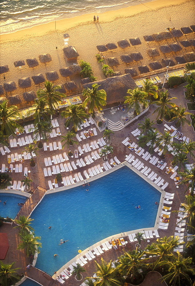 Aerial view of beach with pool and palapas on the beach, Acapulco, Mexico, North America