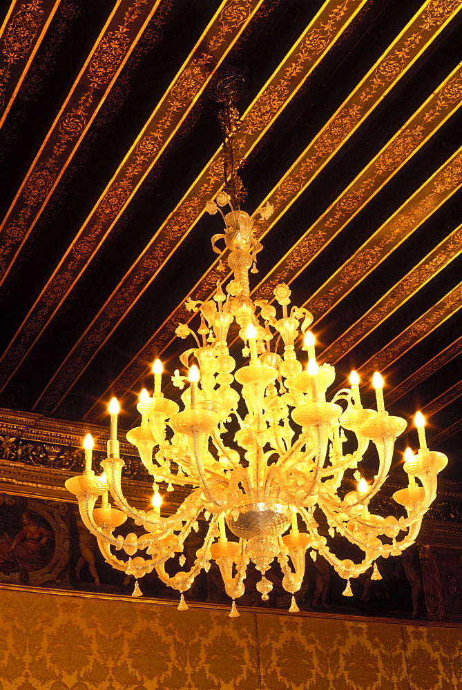 Venetian glass chandelier and ornately painted ceiling beams in the Doge's Palace (Palazzo Ducale), Venice, UNESCO World Heritage Site, Veneto, Italy, Europe