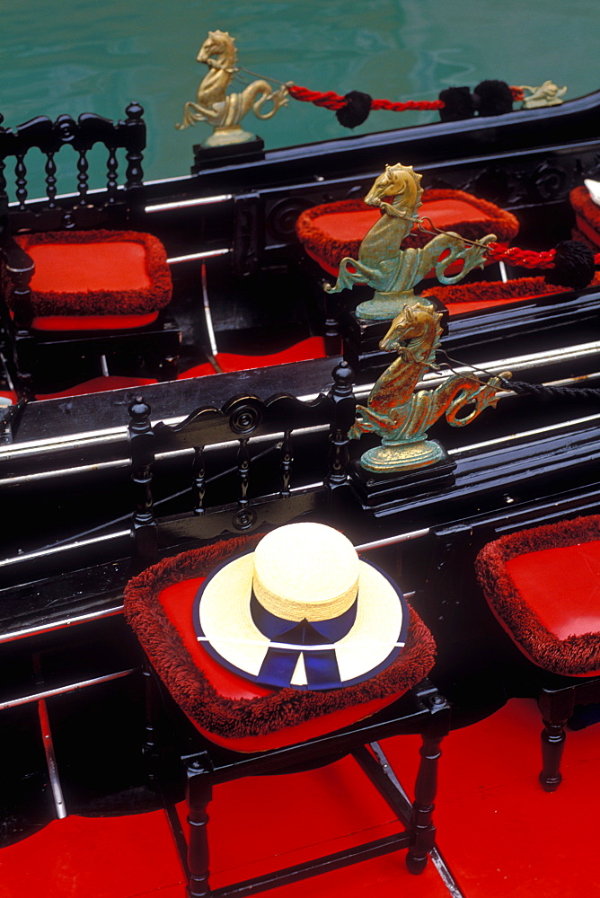 Detail of gondolier's hat and gondolas, Venice, Veneto, Italy, Europe