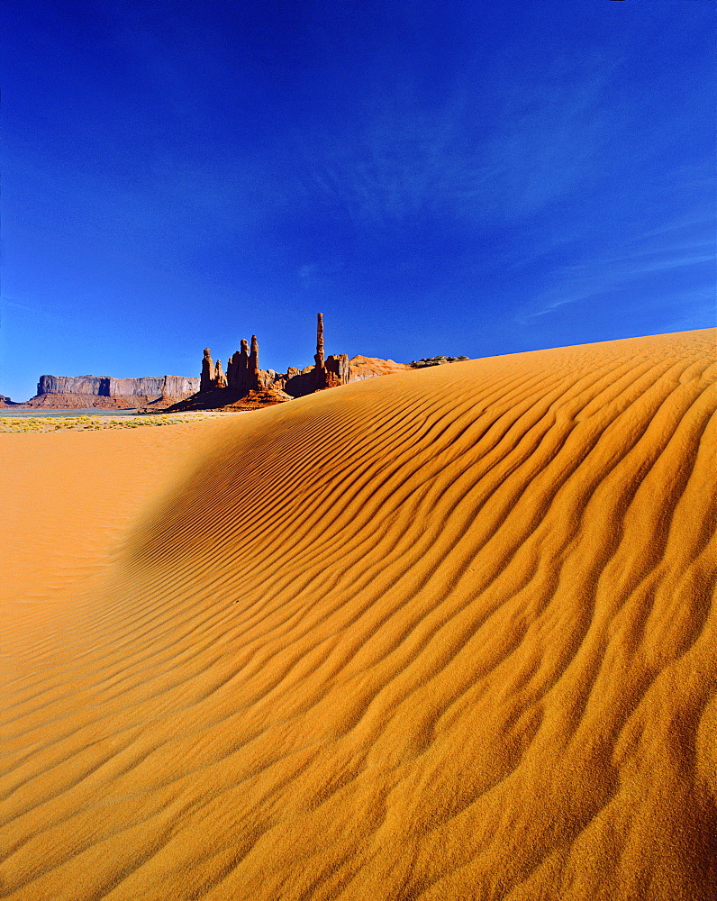 Totem Pole and Yei Bi Chei rock formations and sand dunes, Monument Valley, Arizona, United States of America, North America