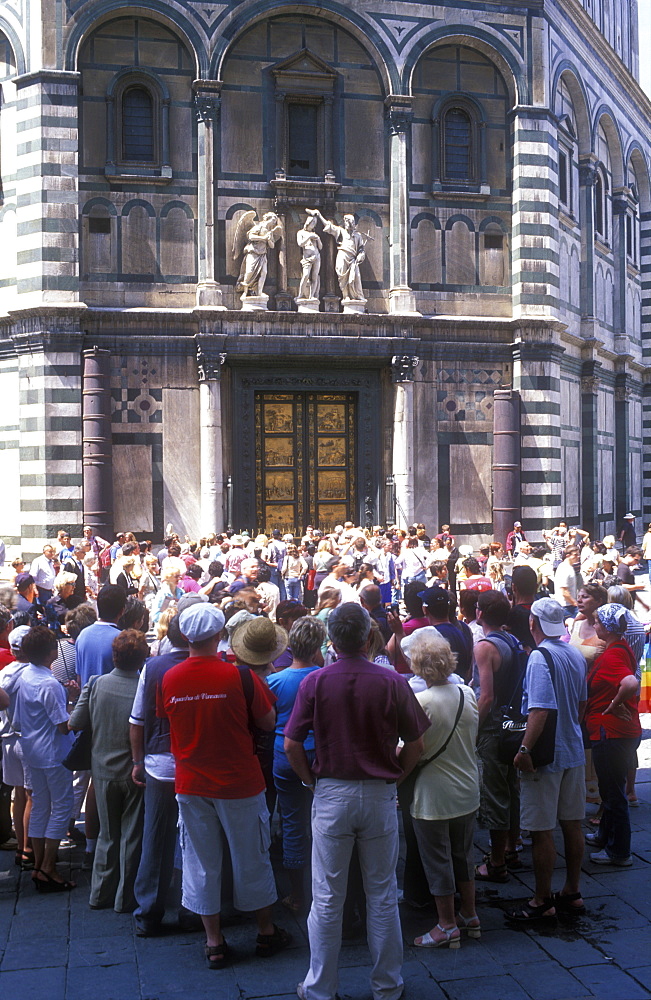 Group of tourists viewing the doors of the Baptistry, Florence, Tuscany, Italy, Europe