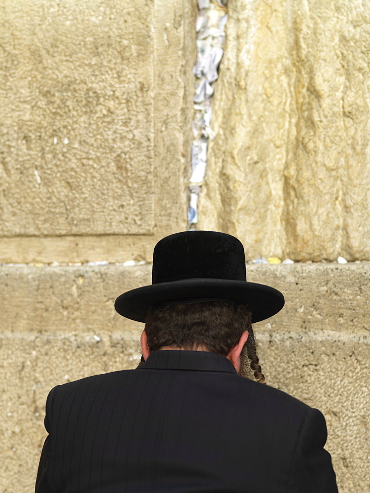 Western Wall (Wailing Wall) with worshipper and prayer slips, Jerusalem, Israel, Middle East