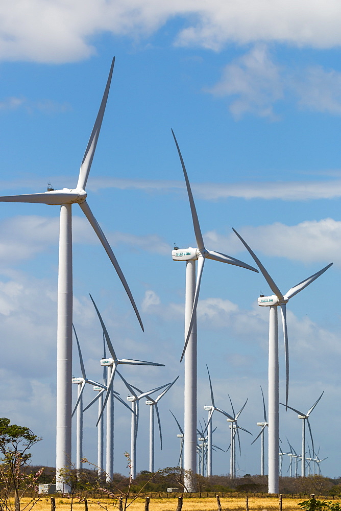 A group of 30 wind turbines by Lake Nicaragua, Nicaragua's first such facility name Amayo) with Concepcion Volcano beyond, Rivas, Nicaragua, Central America