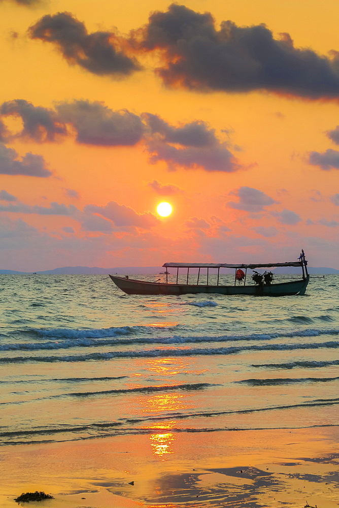 Fishing boat moored off beach south of the city at sunset, Otres Beach, Sihanoukville, Cambodia, Indochina, Southeast Asia, Asia