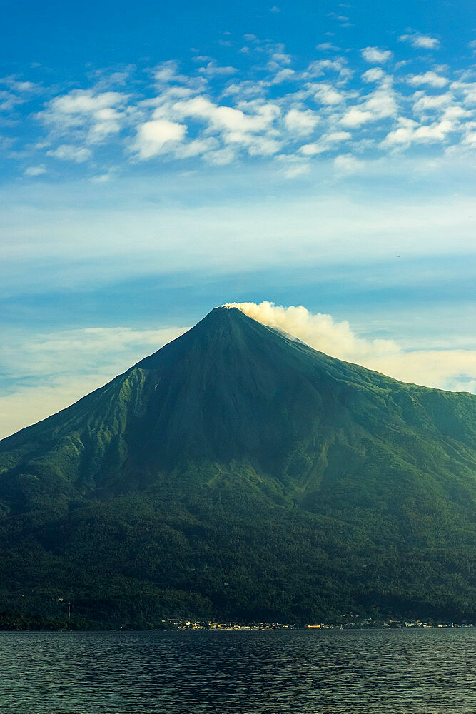 Smoking peak of this active 1784m Pacific Ring of Fire volcano. Mount Karangetang, Siau, Sangihe Islands, Sulawesi, Indonesia