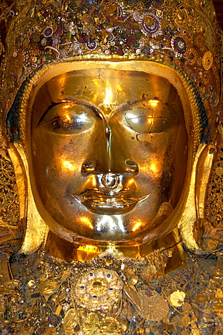 Portrait of the golden Mahamuni Buddha frontally Mandalay Burma