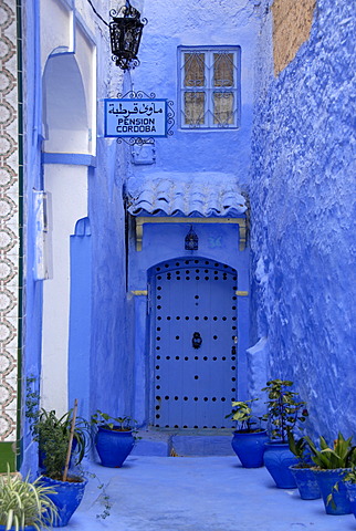 Luminous blue gate of Pension Cordoba medina Chefchaouen Morocco