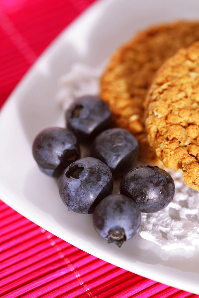 Healthy snack with blueberries and full corn biscuits - close up