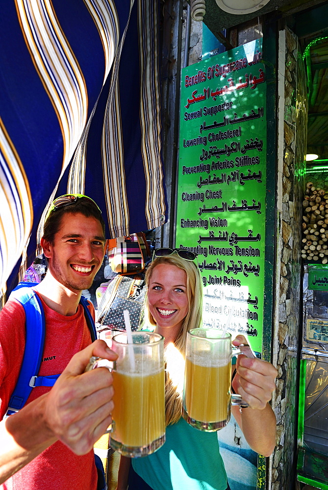 Tourist drink sugarcane-syrop, Al Balat, Amman, Jordan, Asia