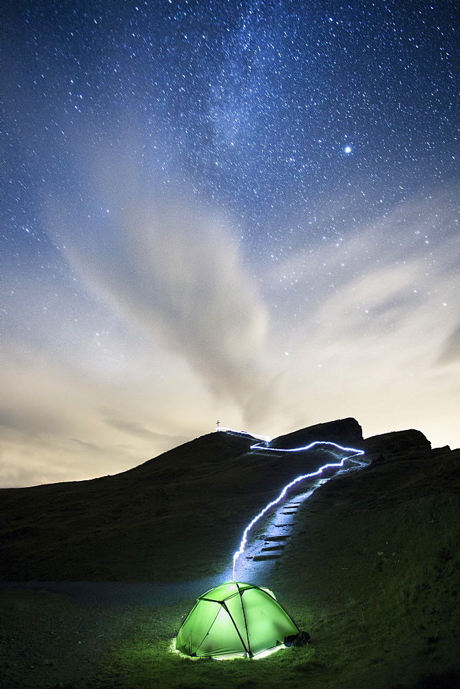 Green glowing tent under the Milky Way with light traces of a flashlight, starry, Diedamkopf in the Bregenzerwald, Vorarlberg, Austria, Europe