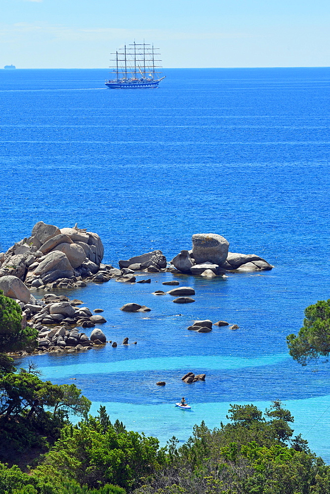 Palombaggia beach with turquoise blue sea and sailing ship, Porto Vecchio, Corse-du-Sud department, Corsica, France, Europe