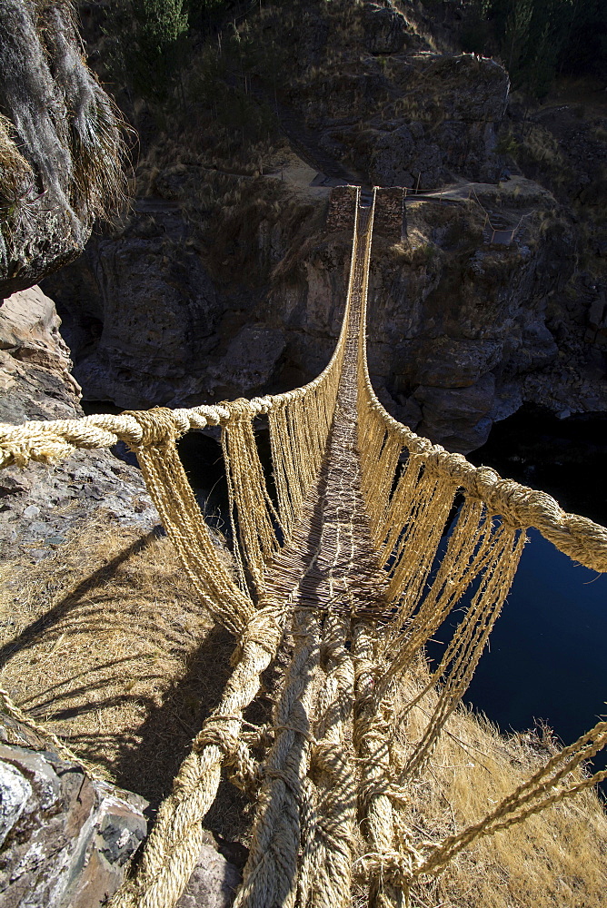 Last intact Inca rope bridge made of braided Peruvian feathergrass (Jarava ichu), across River Apurimac, Peru, South America