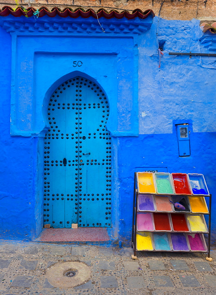 Blue front door, next to color pigments, house facade, blue painted house, medina of Chefchaouen, Chaouen, Tanger-Tétouan, Kingdom of Morocco