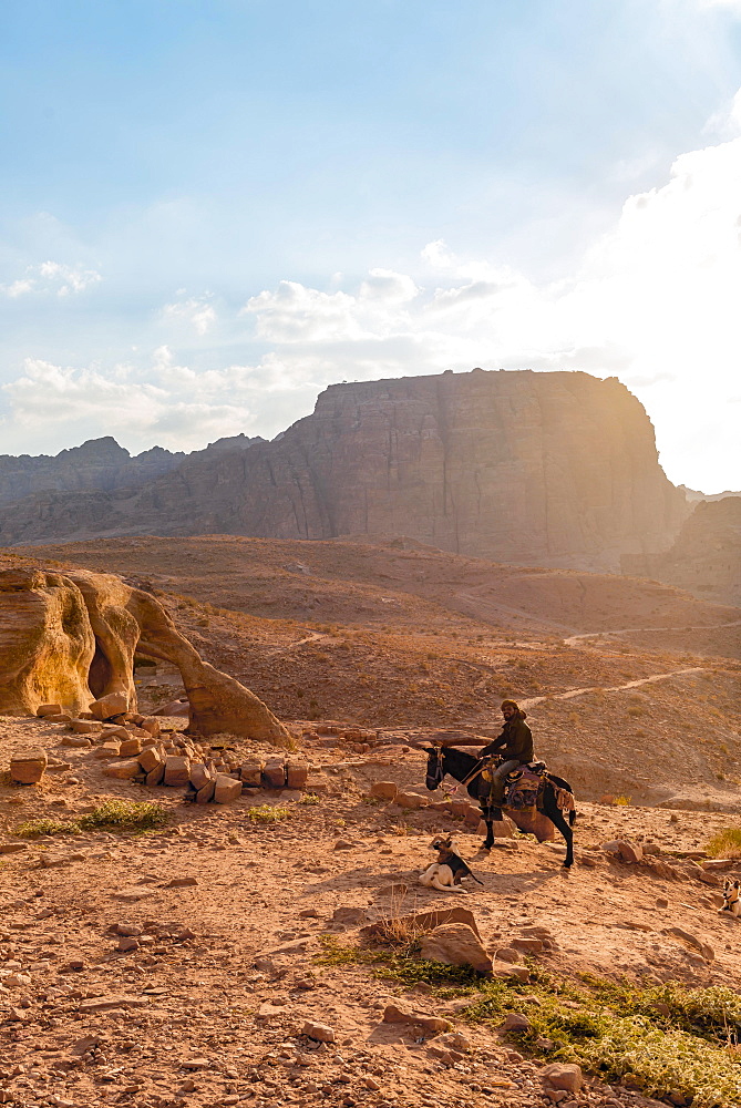 Man on a donkey, Nabataean city Petra, near Wadi Musa, Jordan, Asia