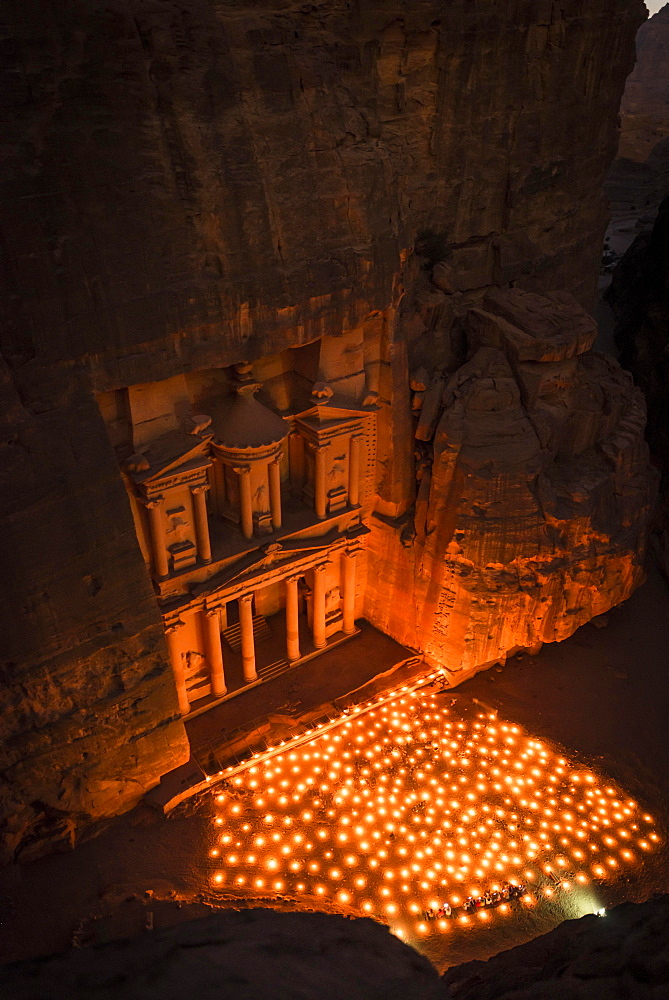 Candles in front of the Pharaoh's treasure house, struck in rock, at night, view from above into the gorge, facade of the treasure house Al-Khazneh, Khazne Faraun, mausoleum in the Nabataean city of Petra, near Wadi Musa, Jordan, Asia