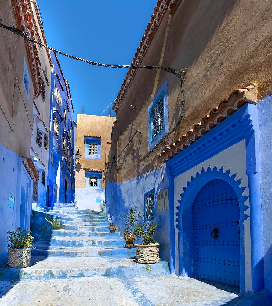 Stairs through narrow alley, blue houses, medina of Chefchaouen, Chaouen, Tanger-Tetouan, Morocco, Africa