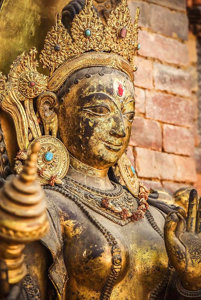 Buddhist deity, golden statue, temple, Patan, Kathmandu valley, Himalaya region, Nepal, Asia