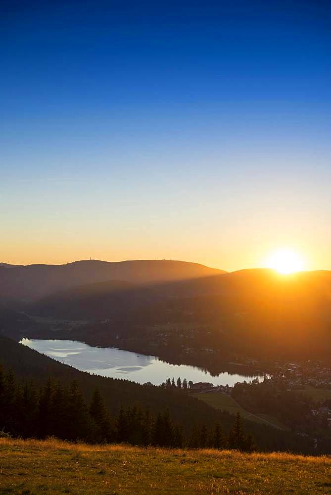 View from Hochfirst to Lake Titisee and Feldberg mountain at sunset, near Neustadt, Black Forest, Baden-Wuerttemberg, Germany, Europe