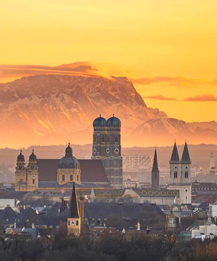 View over Munich with Church of Our Lady, Theatine Church, Ludwigskirche, behind Zugspitze at sunset, Munich, Bavaria, Germany, Europe