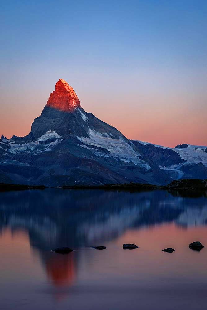 Matterhorn at sunrise reflected in the Stellisee, Zermatt, Valais, Switzerland, Europe