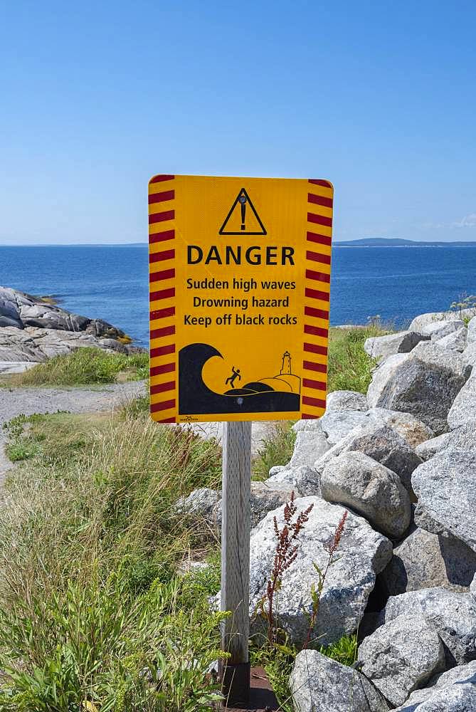 Warning sign for dangerous surf, Peggy's Cove, Nova Scotia, Canada, North America