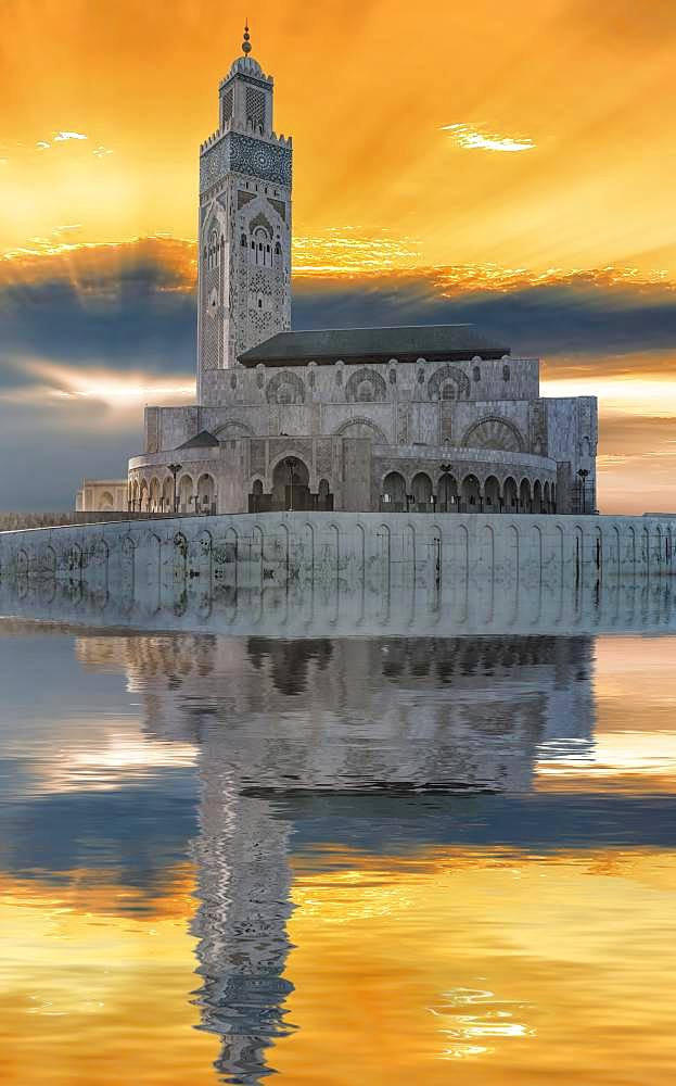 Atmospheric sunset with reflection in the water, Mosque Hassan II, Casablanca, Morocco, Africa