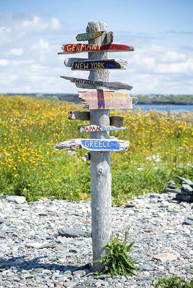 Direction sign in different directions, distance indicator, Cape Forchu, Yarmouth, Nova Scotia, Canada, North America