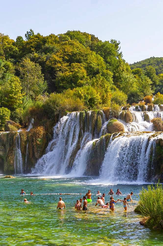 Tourists bathing at the Skradinski Buk waterfall, Krka National Park, Sibenik-Knees Region, Dalmatia, Croatia, Europe