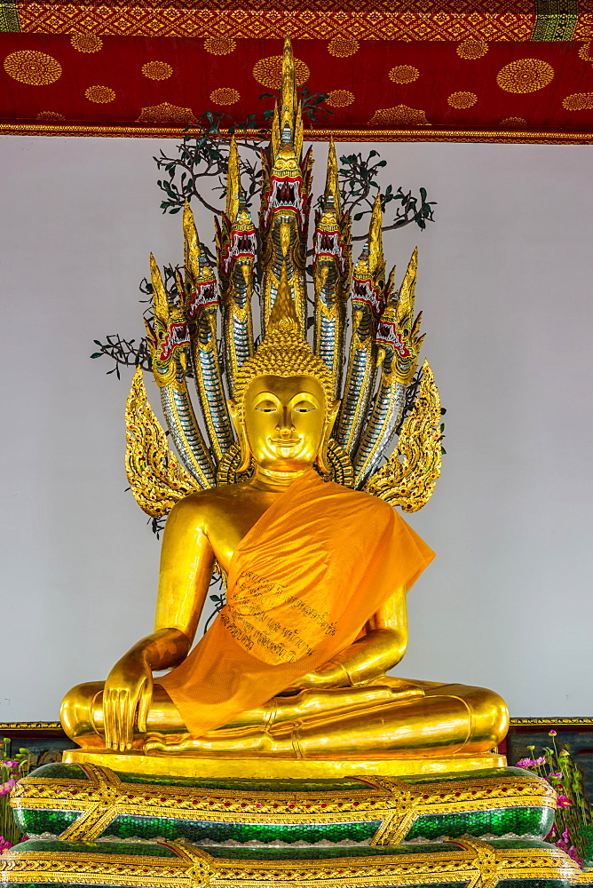 Buddha meditating under the protection of a seven-headed Naga snake, Wat Pho, Bangkok, Thailand, Asia