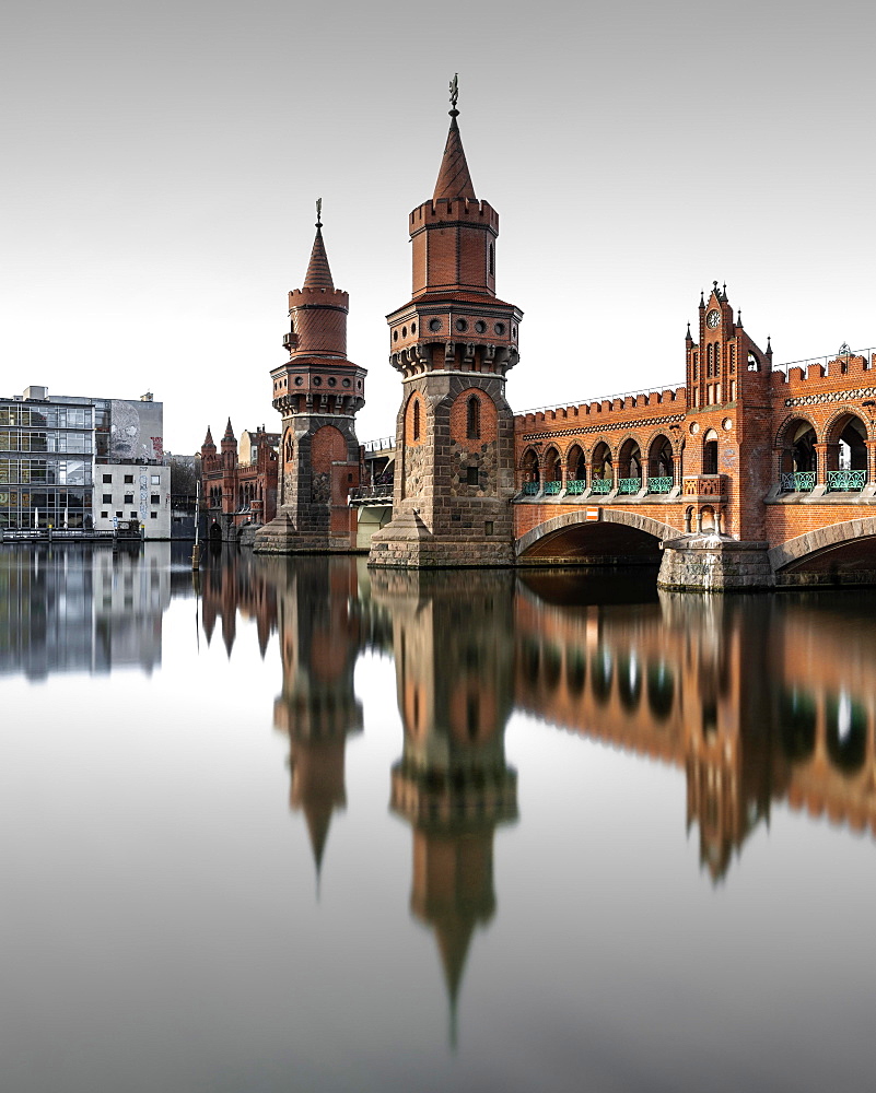 Berlin Oberbaum Bridge at Warschauer Strasse in Berlin with reflection in the Spree, Berlin, Germany, Europe