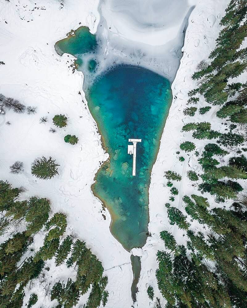 Aerial view, partly frozen Lake Cauma in winter, Grisons, Switzerland, Europe